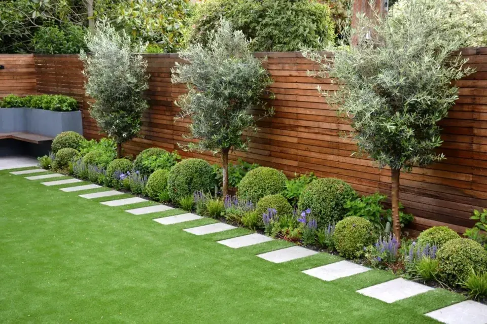 Master residential landscape transformation with lush lawn and mulch beds
